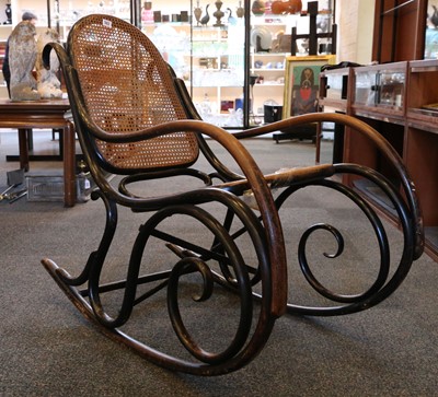 Lot 383 - A Thonet rocking chair, rattan back and seat,...