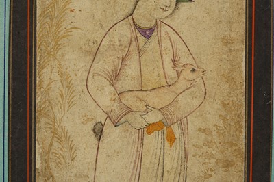 Lot 129 - *A YOUNG SHEPHERD HOLDING A FAWN