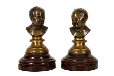 Lot 212 - A pair of late 19th/early 20th century French patinated bronze miniature busts of infants
