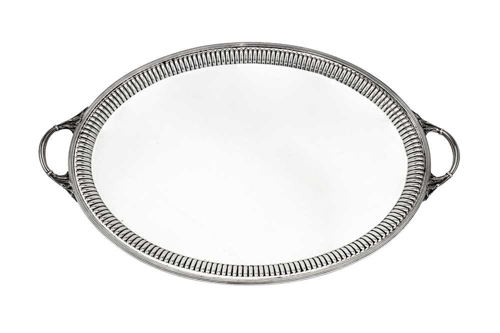 Lot 488 - A Victorian sterling silver twin handled tray, London 1890 by Goldsmiths & Silversmiths Co overstriking another