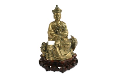 Lot 244 - A Chinese Quan Yin buddha figure seated on a...