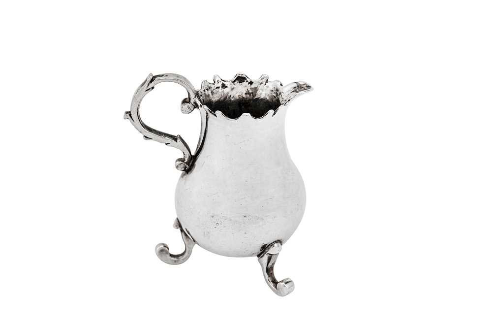 Lot 234 - A mid-18th century Dutch 'toy' miniature silver cream jug, Amsterdam 1768 by Arnoldus Van Geffen (active 1728-69)