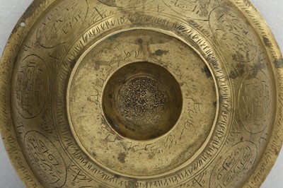 Lot 184 - A SMALL BRASS ENGRAVED MAGIC BOWL