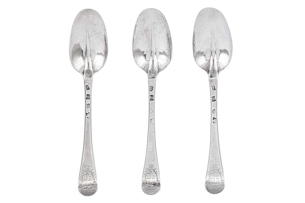 Lot 336 - A set of three George I sterling silver tablespoons, London 1722 by Hugh Arnott and Edward Pocock (reg. 15th Feb 1720)