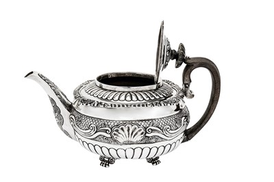 Lot 478 - A George IV sterling silver part-tea service, the teapot London 1821 by Stephen Adams II (reg. 14th Nov 1813)