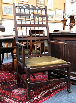 Lot 459 - An oak open armchair with carved and pierced...