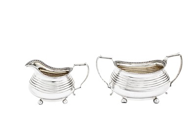 Lot 486 - A George III sterling silver three-piece tea service, London 1814 by Alice and George Burrows II (reg. 10th July 1801), overstriking that of Crispin Fuller (reg. 29th Dec 1792)