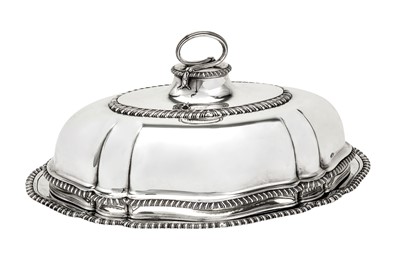 Lot 574 - A matched George II / George III sterling silver meat dish and cover, the base London 1748 by Charles Fredrick Kandler (reg. 10 Sep 1735)