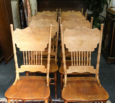 Lot 449 - A set of eight American oak and elm chairs...