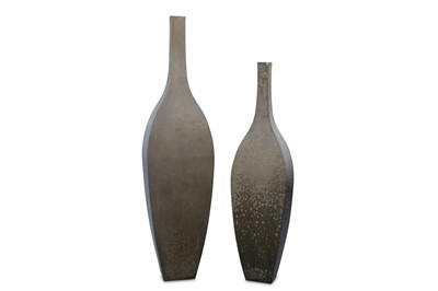 Lot 555 - A graduated pair of De Castelli steel bottle form garden planters