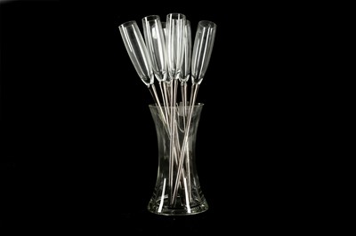 Lot 407 - Six champagne stem glasses with silvered stem in a waisted clear glass vase