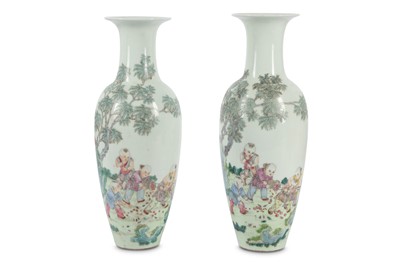 Lot 242 - A pair of Chinese famille rose 'boys' vases.