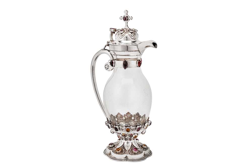 Lot 543 - An Edwardian sterling silver mounted glass ecclesiastical claret jug, Sheffield 1904 by John Round & Son Ltd