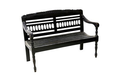Lot 551 - An Anglo-Indian ebonised two seater bench