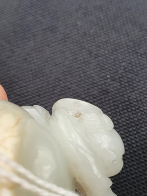 Lot 649 - A CHINESE WHITE JADE 'BOY AND BUFFALO' GROUP.