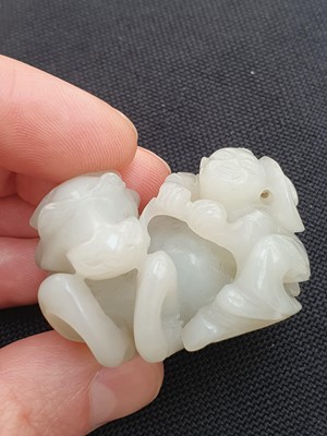 Lot 649 - A CHINESE WHITE JADE 'BOY AND BUFFALO' GROUP.