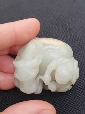 Lot 649 - A CHINESE WHITE JADE 'BOY AND BUFFALO' GROUP.
