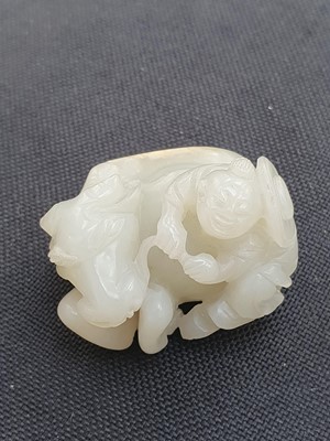 Lot 649 - A CHINESE WHITE JADE 'BOY AND BUFFALO' GROUP.