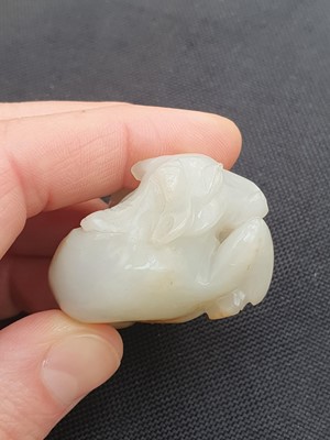 Lot 649 - A CHINESE WHITE JADE 'BOY AND BUFFALO' GROUP.