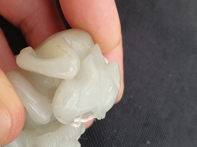 Lot 649 - A CHINESE WHITE JADE 'BOY AND BUFFALO' GROUP.