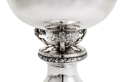 Lot 524 - A large George V ‘arts and crafts’ sterling silver bowl on stand, London 1935 by Charles Boyton