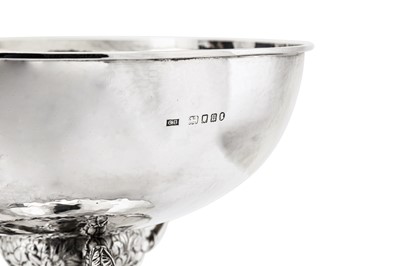 Lot 524 - A large George V ‘arts and crafts’ sterling silver bowl on stand, London 1935 by Charles Boyton