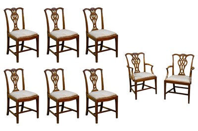 Lot 280 - A set of eight James Shoolbred & Co Chippendale style walnut dining chairs