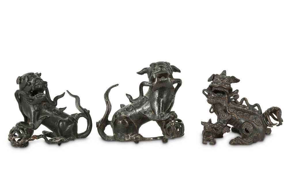 Lot 218 - Three Chinese bronze Buddhist lion dogs.