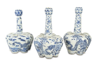 Lot 574 - THREE CHINESE BLUE AND WHITE 'DRAGON' TULIP VASES.