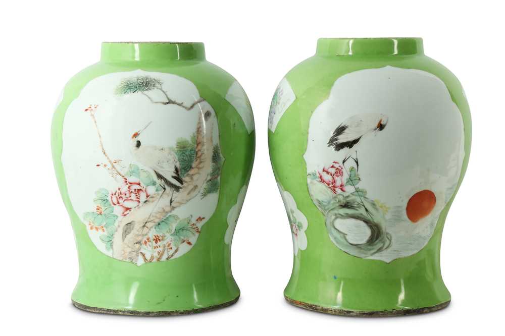 Lot 220 - A pair of Chinese apple green baluster vases.