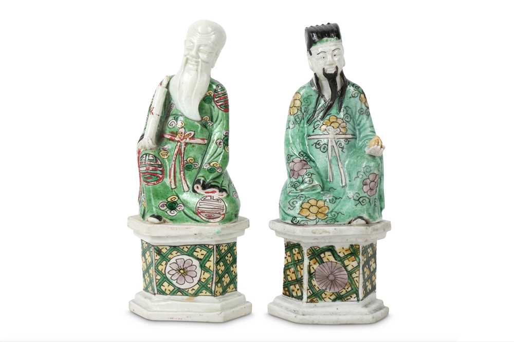 Lot 101 - A PAIR OF CHINESE FAMILLE VERTE FIGURES OF IMMORTALS.
