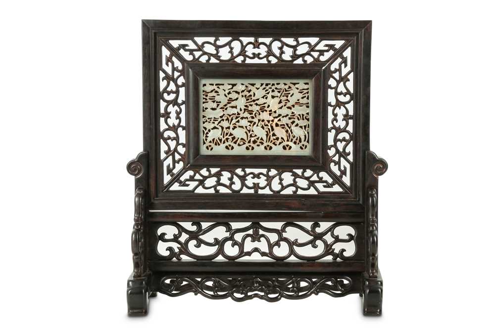 Lot 224 - A Chinese jade plaque mounted as table screen.