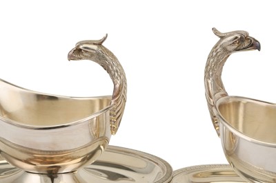 Lot 68 - A near pair of large French silver plated Christofle Malmaison pattern Royal eagle head gravy boats