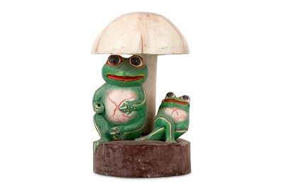 Lot 191 - A CARVED AND PAINTED WOOD FIGURE OF FROGS BENEATH A MUSHROOM