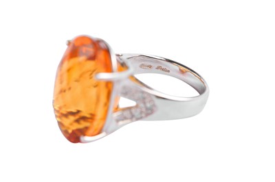 Lot 63 - A citrine and diamond ring