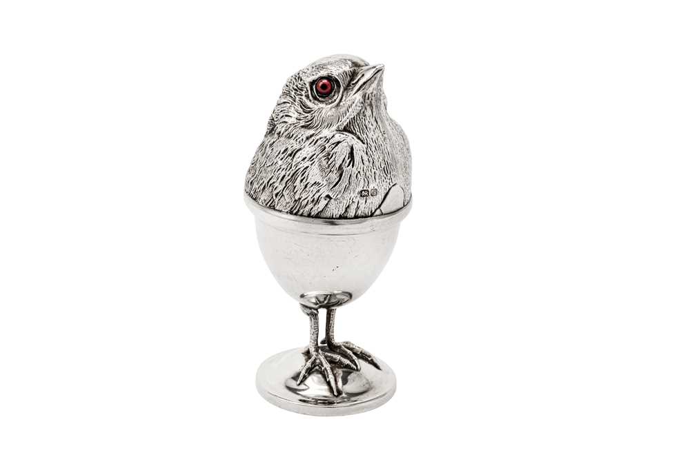 Lot 226 - A rare Edwardian sterling silver novelty egg cup and cover, Chester 1909 by Davis, Moss & Co