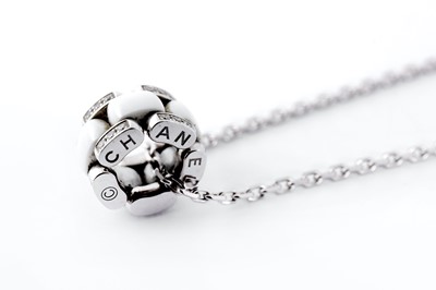 Lot 48 - A ceramic and diamond 'Ultra' pendant necklace, by Chanel