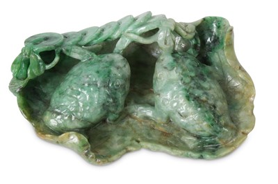 Lot 275 - A Chinese apple-green jadeite 'three-legged toad' carving.