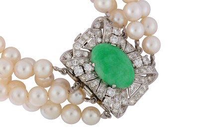 Lot 3 - A cultured pearl necklace and bracelet suite with jade and diamond clasps, circa 1950