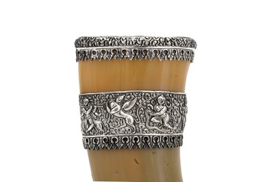 Lot 408 - An early to mid – 20th century Indian unmarked silver mounted cow horn, Trichinopoly circa 1920-50