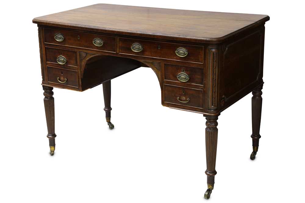 Lot 309 - A George III mahogany kneehole desk