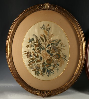 Lot 372 - A large oval antique needlework picture of...