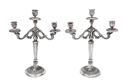 Lot 401 - A mid-20th century pair of Italian 800 standard silver three light candelabra, Vercilli 1944-68 by Angelo di Antonio Mascherpa