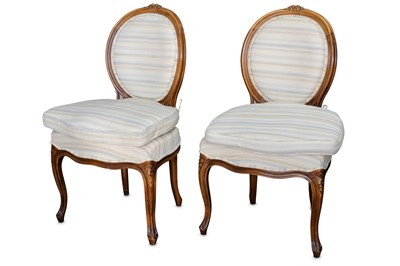 Lot 471 - A set of twelve French Louis XV style beech dining chairs
