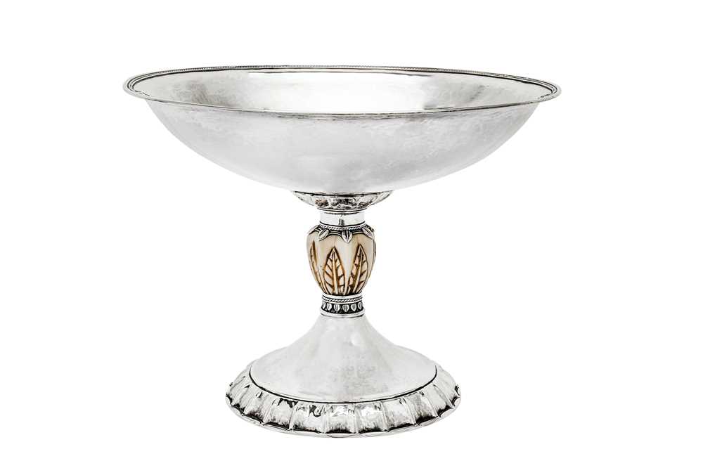 Lot 524 - A unique George V unmarked silver and ivory ‘arts and crafts’ pedestal footed bowl, circa 1920, designed by Norman W. Reynolds