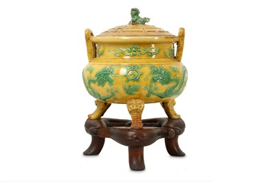Lot 443 - A CHINESE GREEN AND YELLOW-GLAZED 'DRAGON' INCENSE BURNER AND COVER.