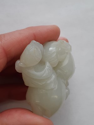 Lot 61 - A CHINESE WHITE JADE 'BOY AND RAM' CARVING.