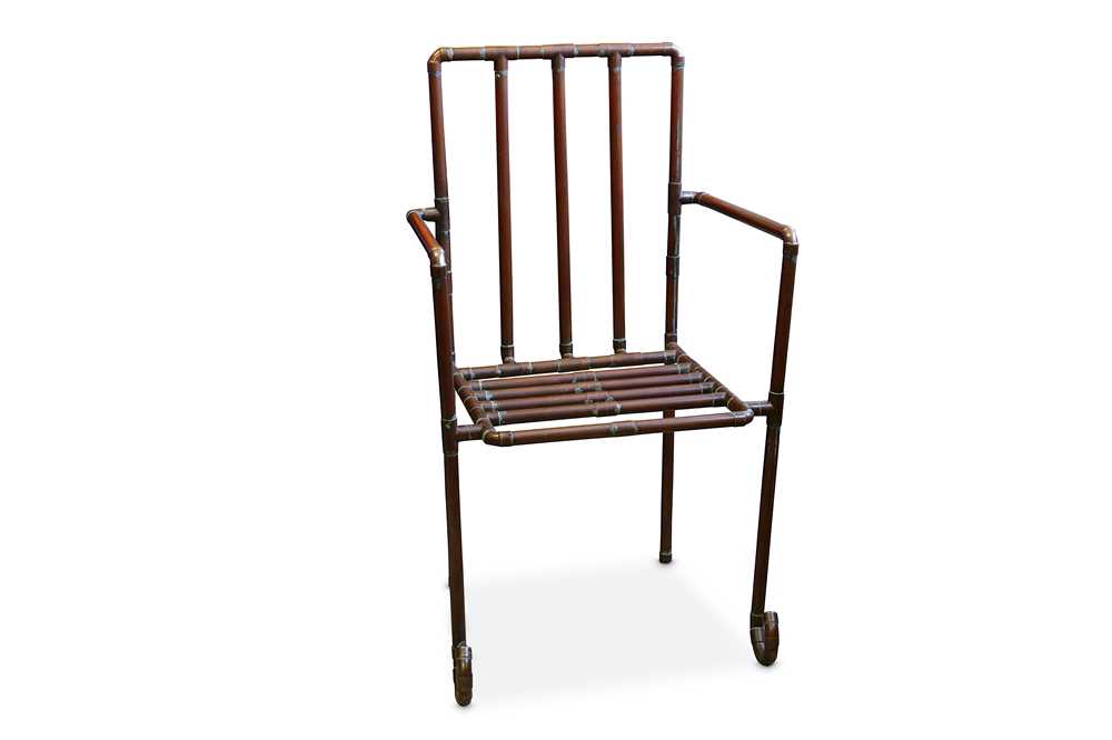 Lot 153 - A 20TH CENTURY INDUSTRIAL STYLE ARM CHAIR FORMED OF COPPER PIPING