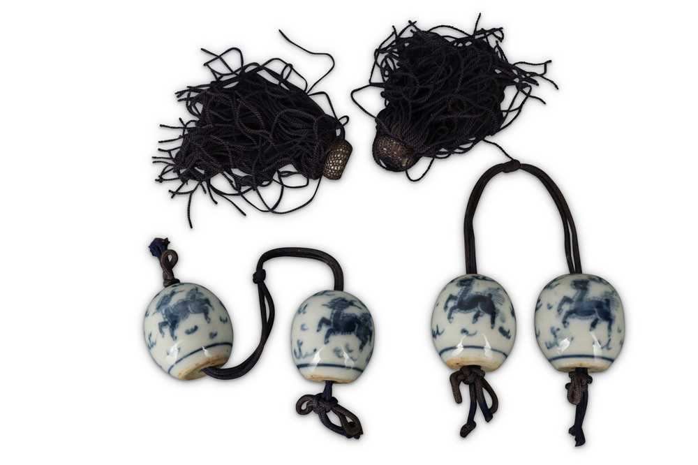 Lot 346 - FOUR CHINESE BLUE AND WHITE SCROLL WEIGHTS.