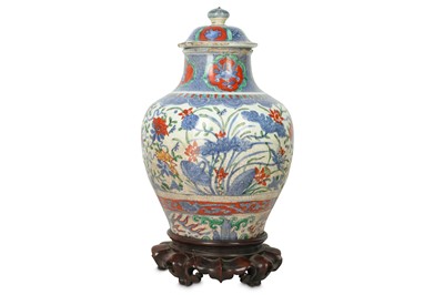 Lot 20 - A CHINESE BLUE AND WHITE ENAMELLED VASE AND COVER.
